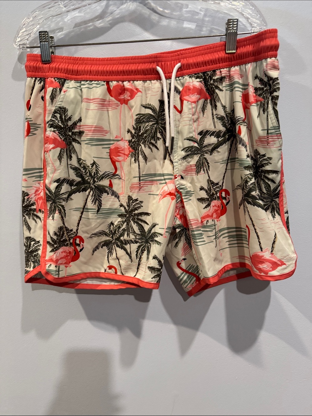 Maamgic flamingo print swim trunks feature a vintage 80s-90s style with a contra